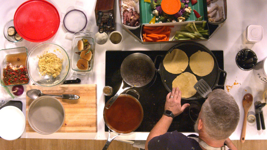 A cook preparing a meal