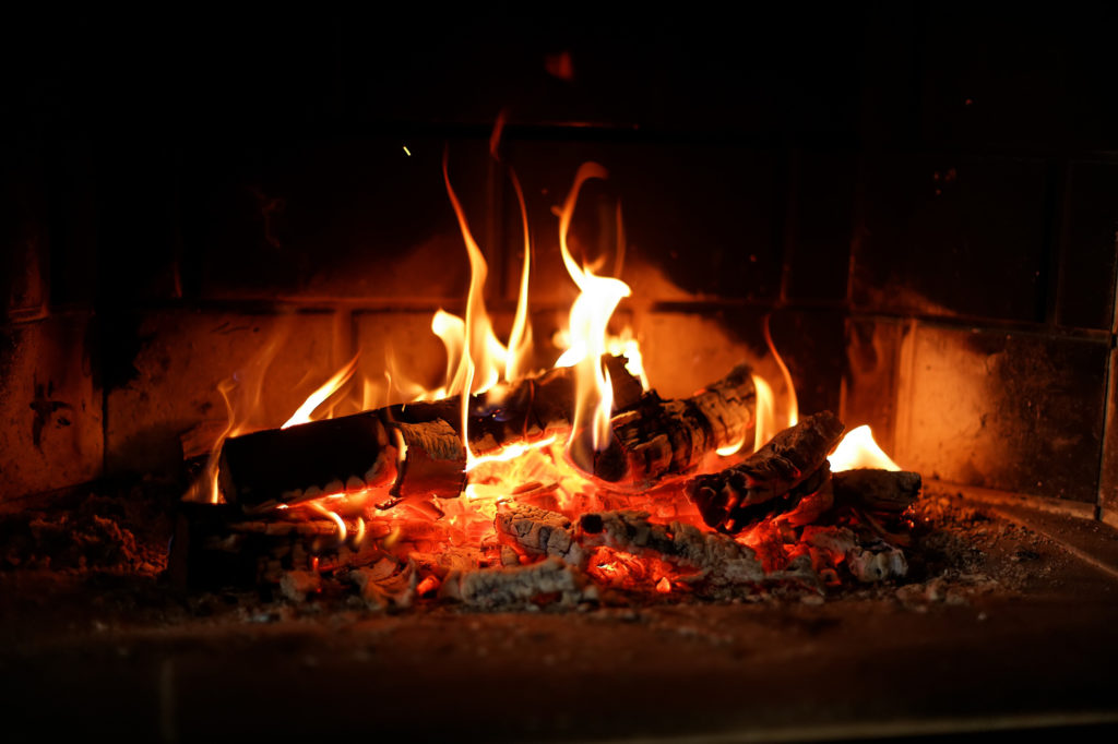 Fireplace with burning logs